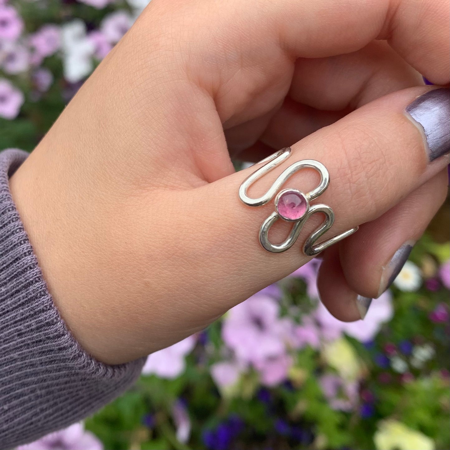 A pink tourmaline and sterling silver ring