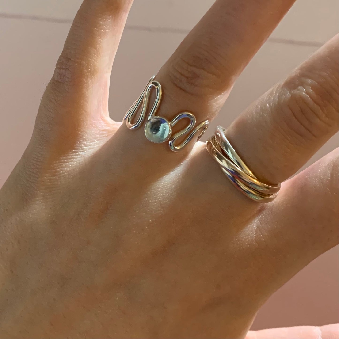 A sky blue topaz and sterling silver ripple ring