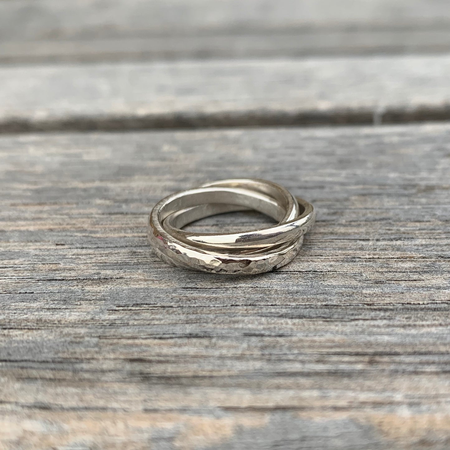 A sterling silver russian wedding ring with a hammered band.