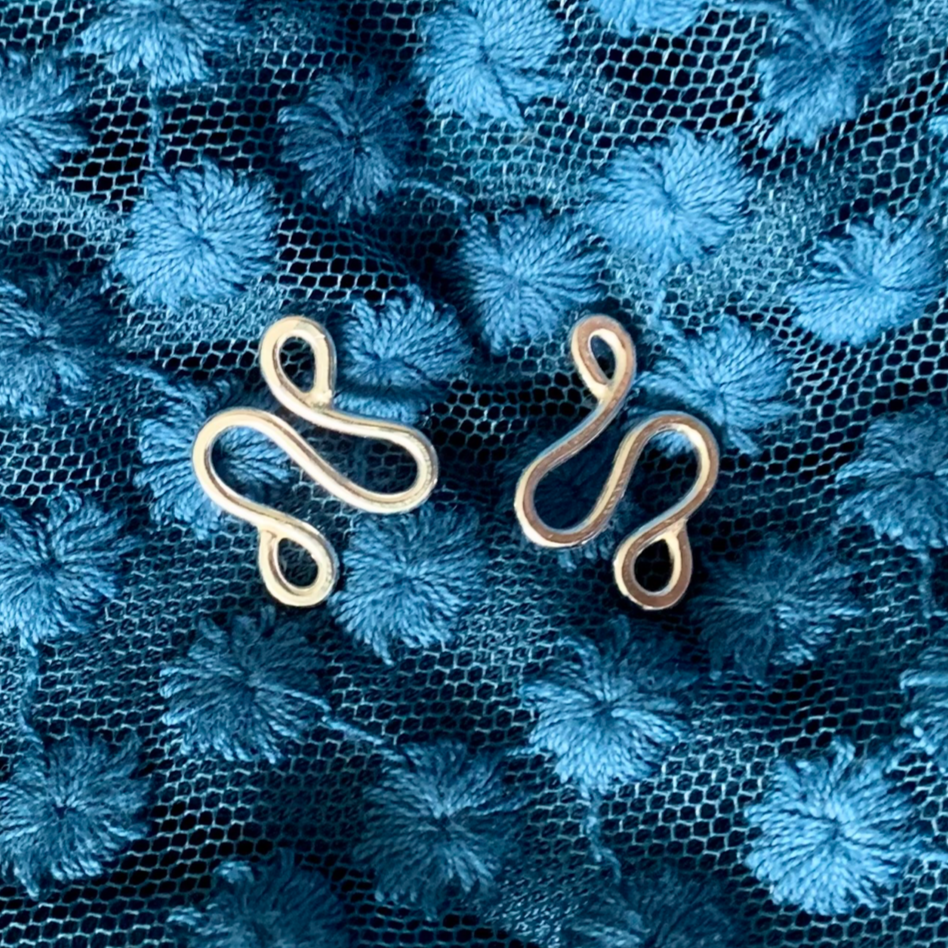 Handmade, sterling silver earrings in a unique ripple shape.