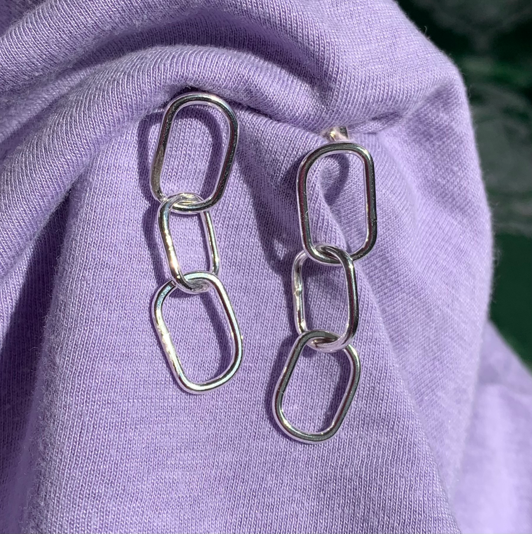 Sterling silver rectangular pastille triple-chain link earrings.