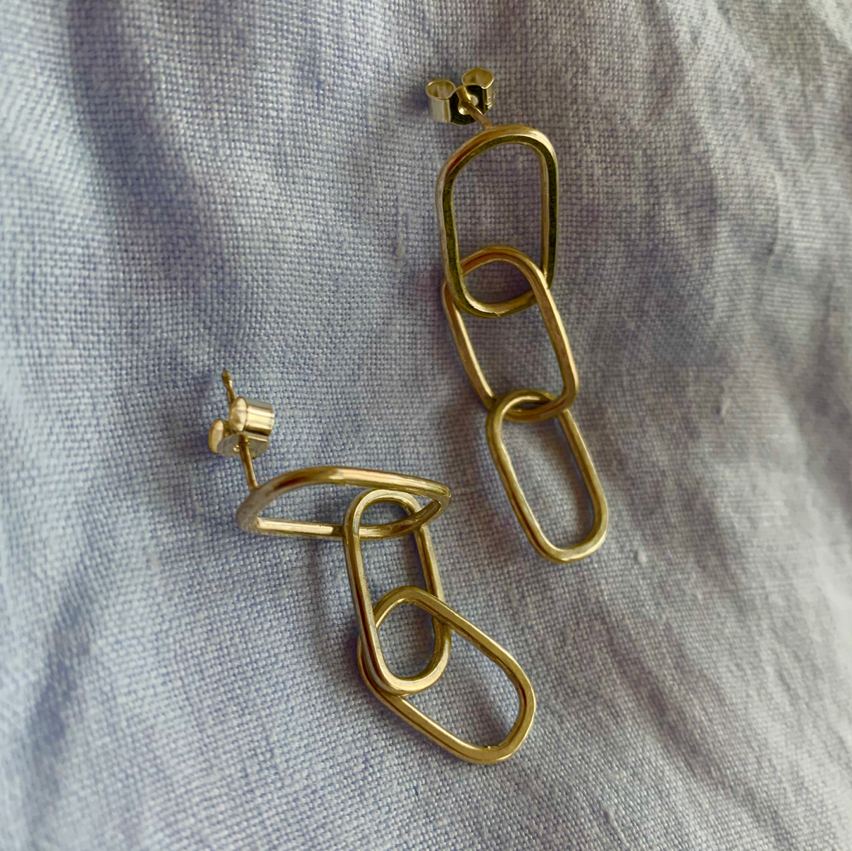 Gold rectangular pastille triple-chain link earrings.