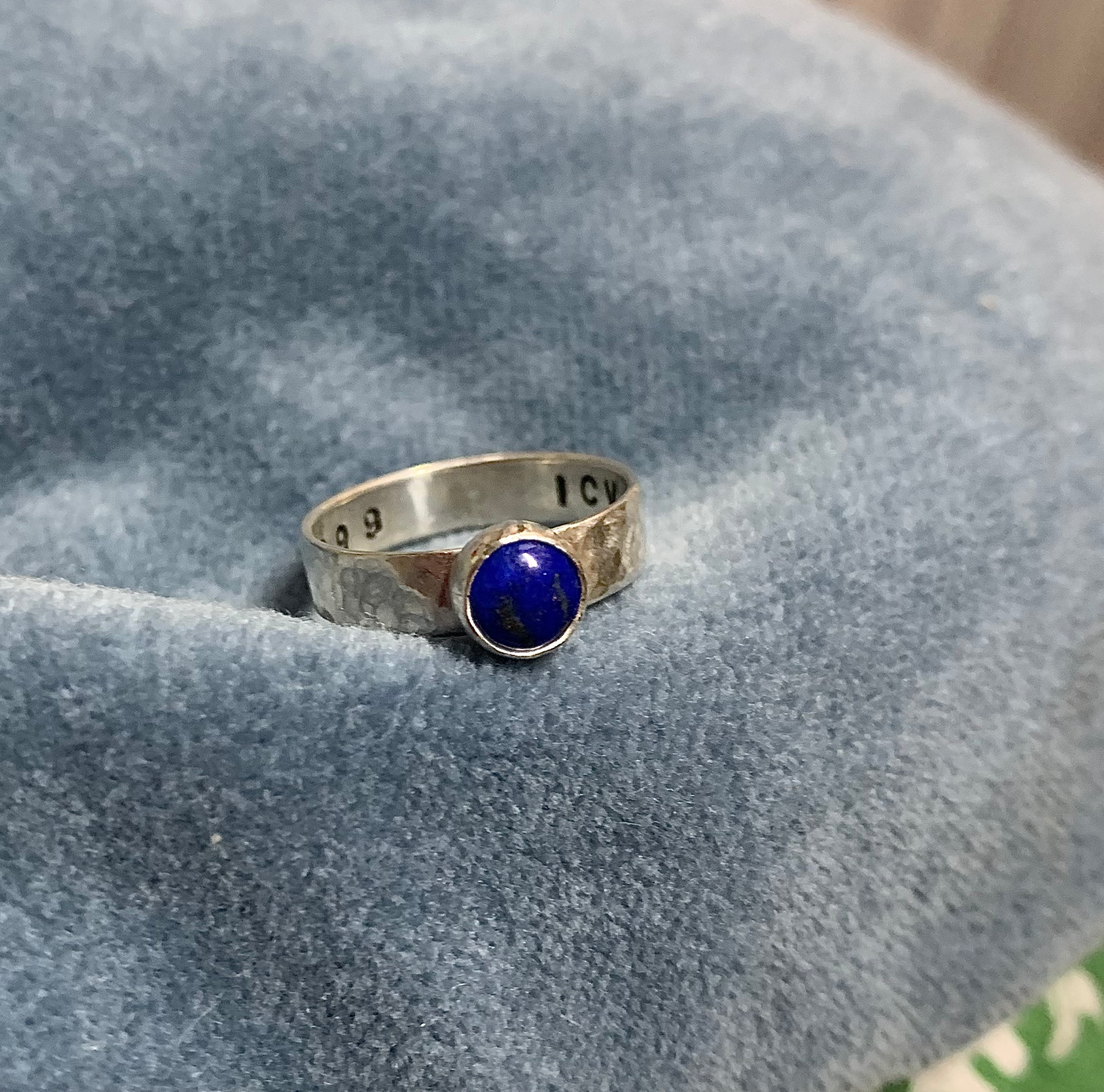 Small round gemstone ring with engraving