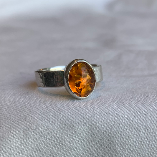Large oval gemstone ring with engraving