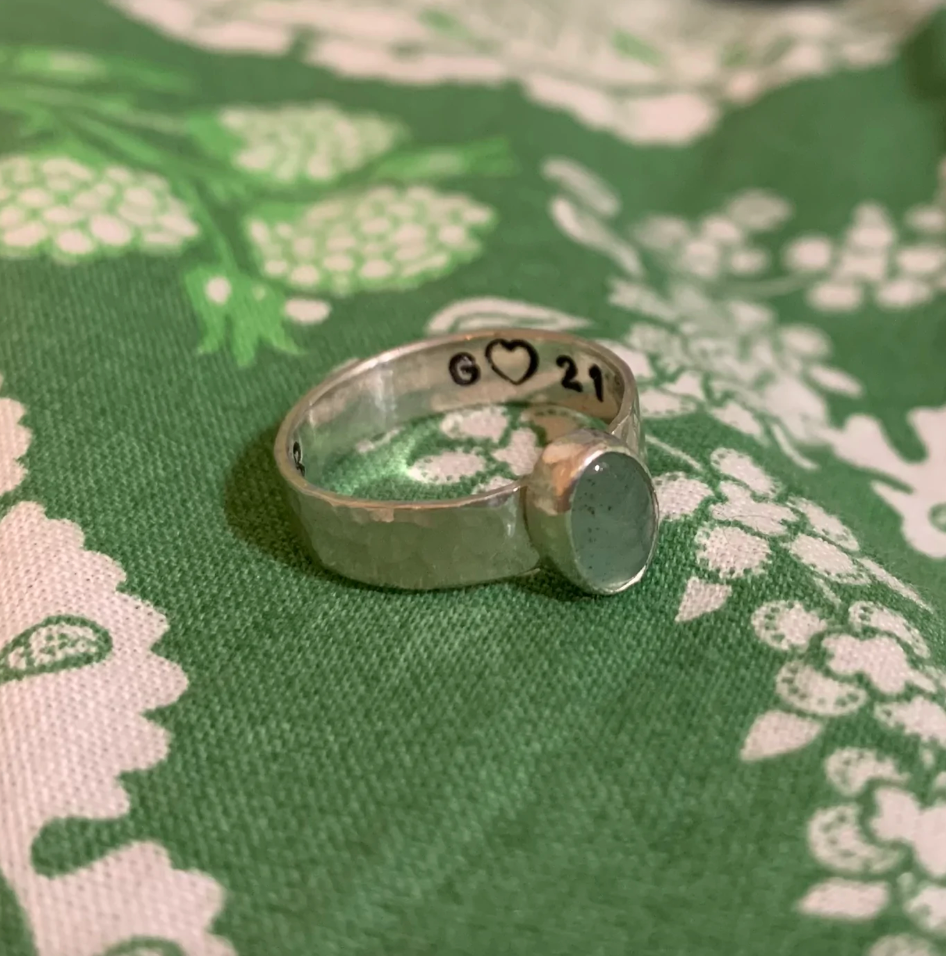 Small oval gemstone ring with engraving