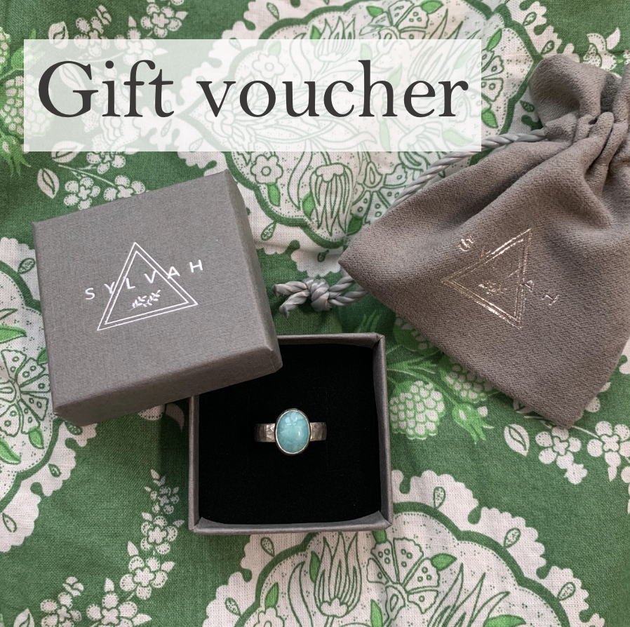 An image saying gift voucher on a green background with an amazonite ring pictured in the foreground.