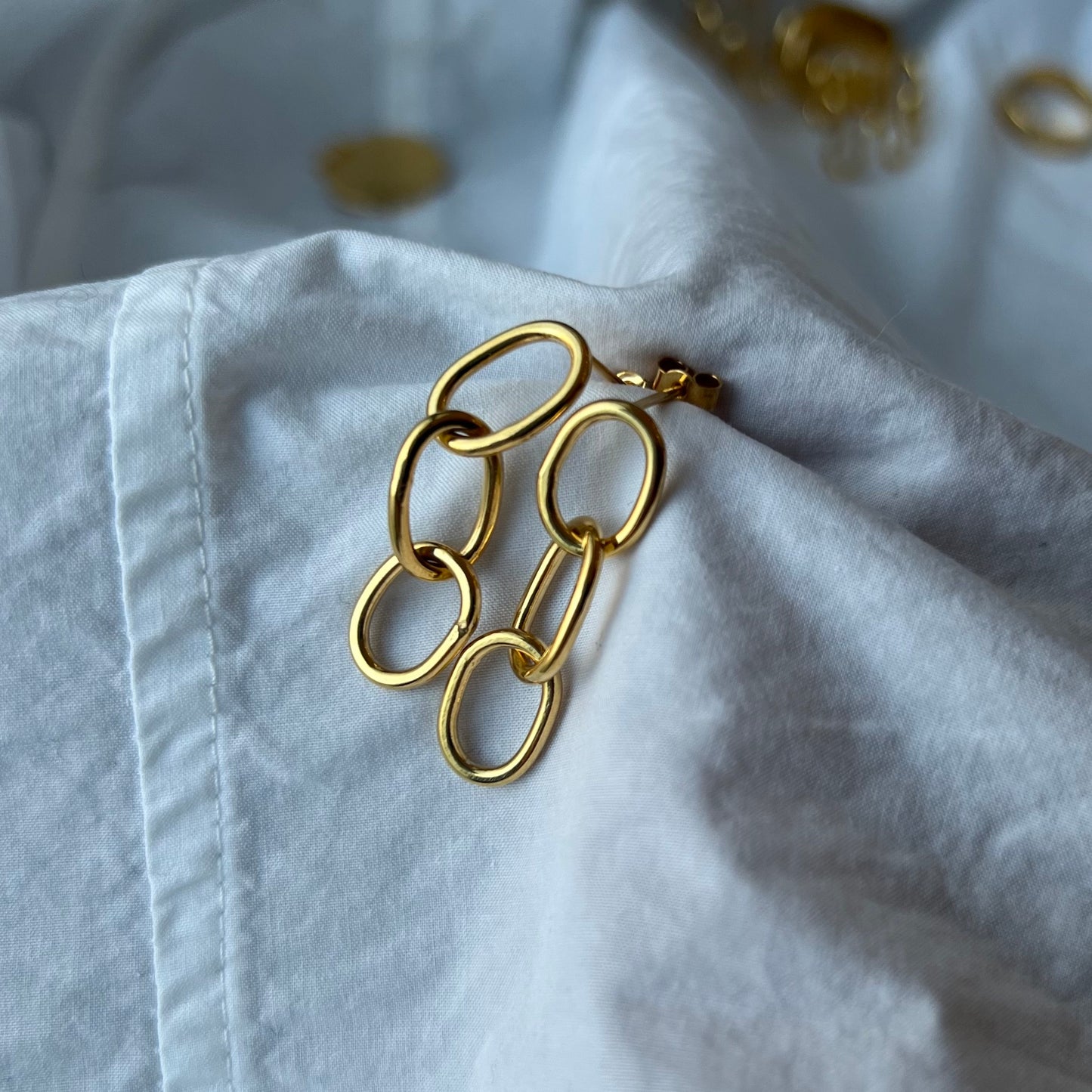 Gold vermeil oval pastille triple-chain link earrings.