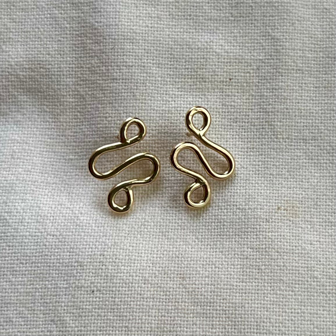Handmade, gold-filled earrings in a unique ripple shape.